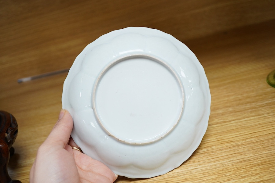 A Chinese famille rose moulded saucer dish, Yongzheng/Qianlong, 16cm in diameter. Condition - fair